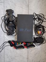 PS 2, 2 Controller, 16 Spiele im akzeptablem Zustand