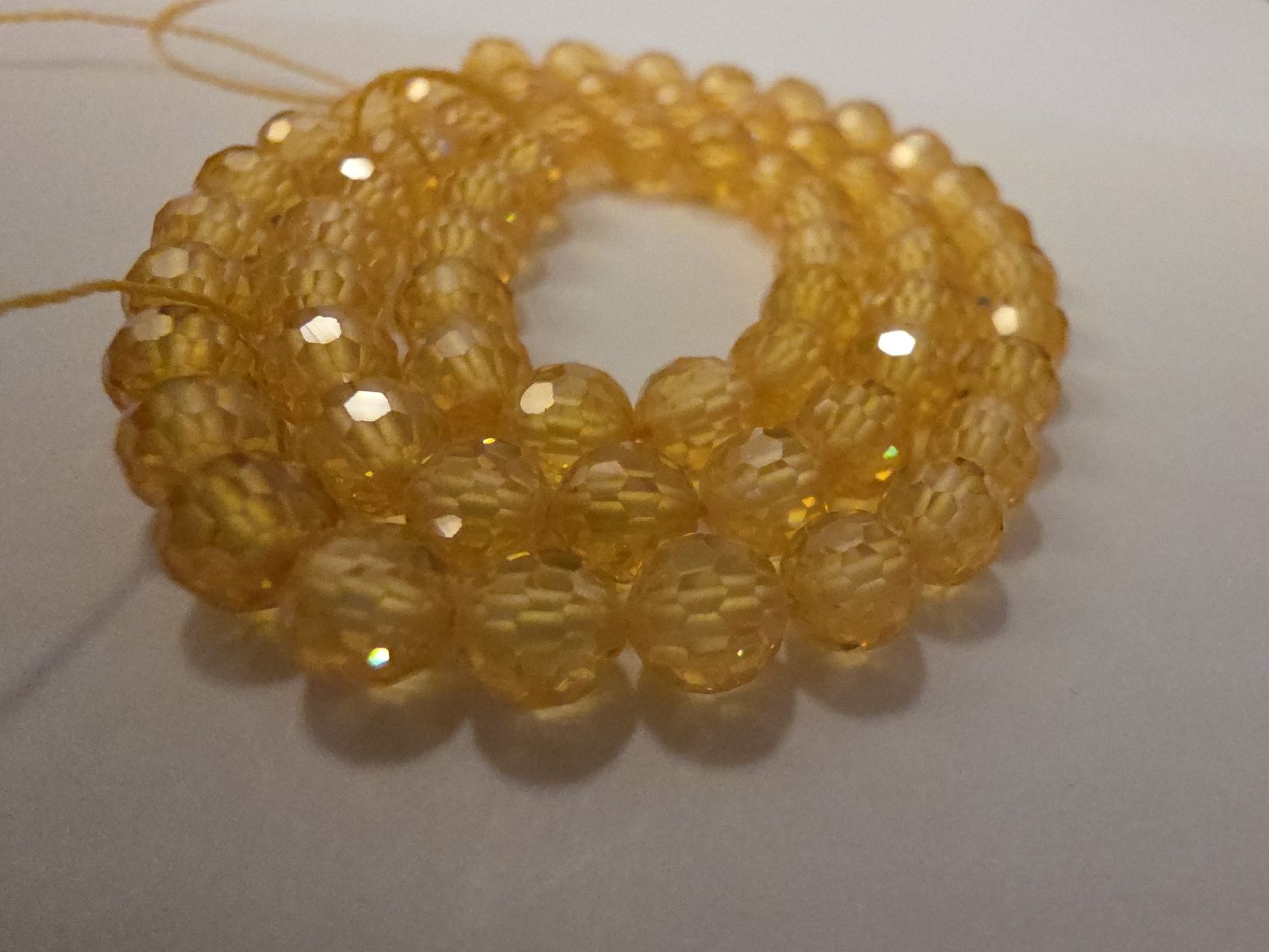 Minerali & Pietre curative: Zirkon gelb facettiert 6mm. Strang – Nuovo e nell'imballaggio originale da Menziken venduto da Mirager 2