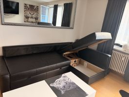 Ecksofa mit Schlaffunktion schwarz Gebrauchsspuren