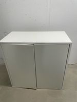 White cabinet with two doors, used