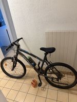 VTT B’TWIN Rockrider 26” – 21 vitesses – Suspension avant –