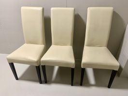 3 beige synthetic leather dining chairs 