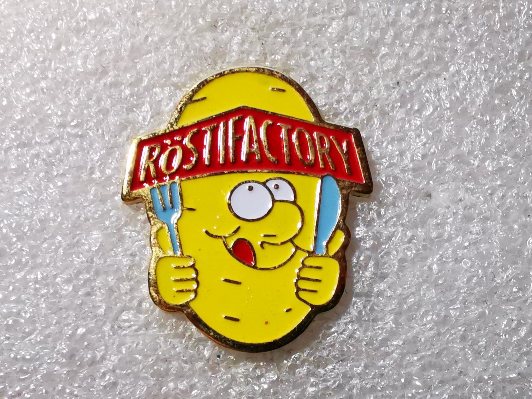 Placchette & Badge: Ansteckpin 50: Röstifactory – Usato da Oppligen venduto da Pin-Fall-Shop