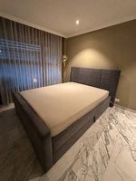 Graues Boxspringbett 160 × 200 cm mit Stauraum