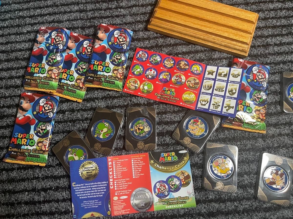 Tutti le monete: 18 Stk. Nintendo Super Mario Challenge Coins + Displaybrett – Nuovo e nell'imballaggio originale da Aesch BL venduto da CollectorsBest 2