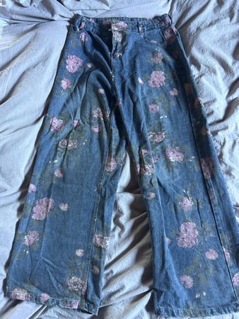 Blue denim jeans with pink floral print