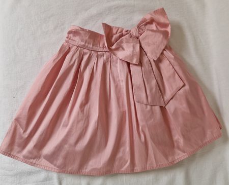 Eleganter Next Rock – Rosa mit Masche – Gr. 110 (5 J.)