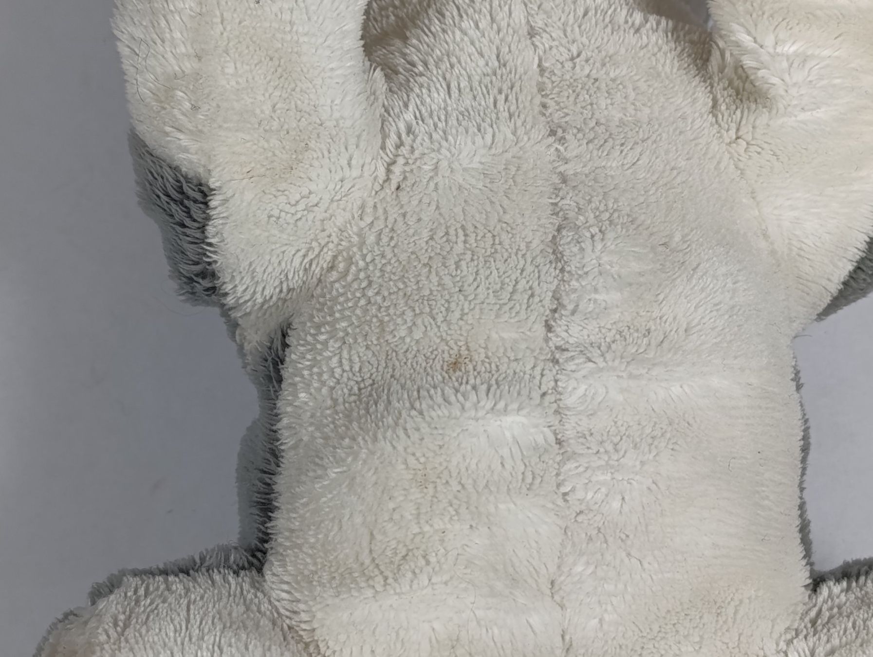 Migros Spielzeuge: MIGROS Peluche de chien gris et blanc – Gebraucht aus Thielle von Plusvalue_Neuchatel 3