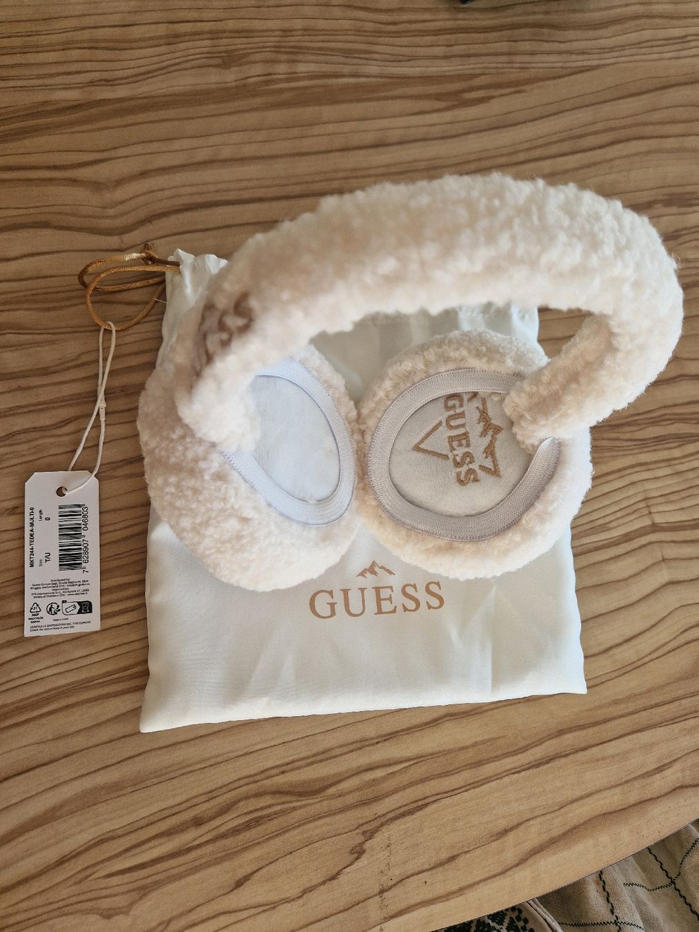 Guess Copricapi, berretti & cappellini: Cache-oreilles beige Guess neufs – Nuovo e nell'imballaggio originale da Delémont venduto da bouboute01