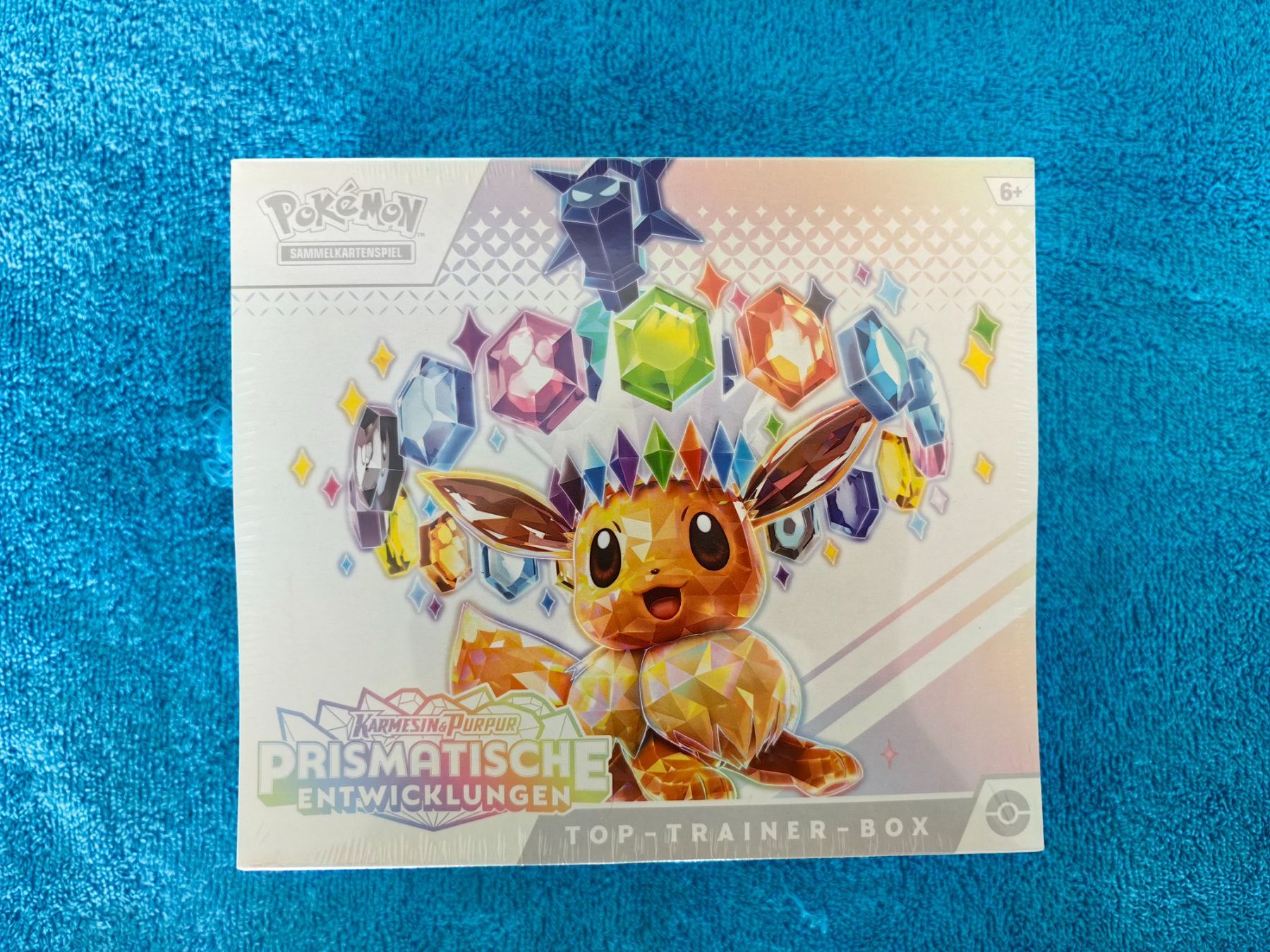 Pokémon Cartes à collectionner: Prismatische Entwicklung Top Trainer Box – Neuf avec emballage d'origine à Dübendorf par Exory