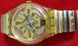 Montre Swatch dorée vintage - Élégance et originalité