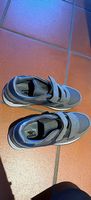 Scarpe con strappo