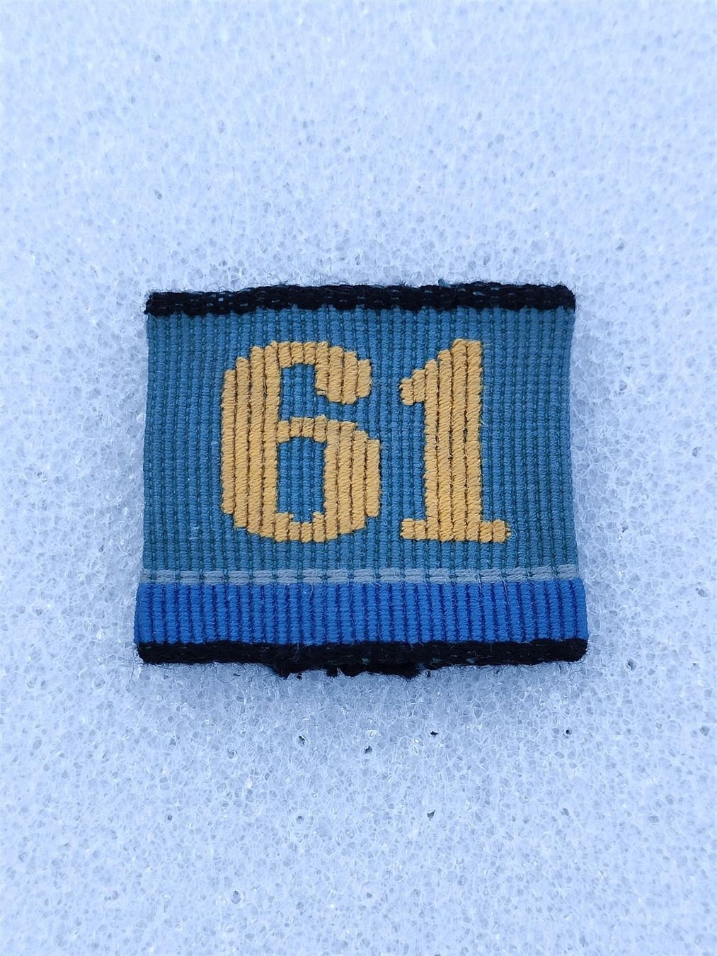 Placchette & Badge: Achselschlaufe Versorgungstruppen Bat 61 – Usato da Bauma venduto da SwissMilitaria