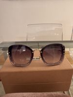Miu Miu MU 02TS 86LNJ0 Sunglasses – Transparent Dark Violet 