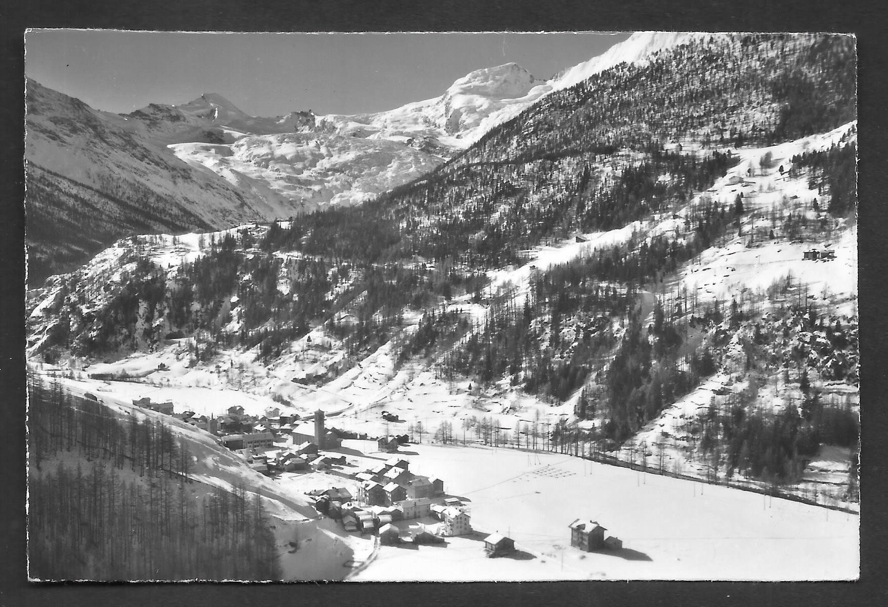 Cartoline postali: Saas - Grund Dorfansicht im Winter – Usato da Olten venduto da clotaldi