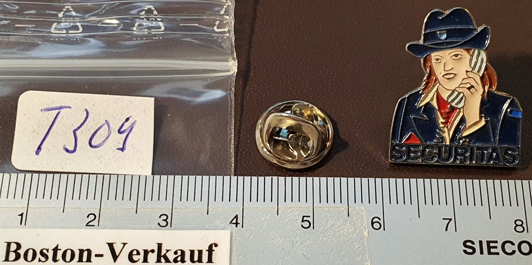 Placchette & Badge: T309 - Pin Securitas Frau / silberig – Usato da Reinach BL venduto da Boston-Verkauf 1