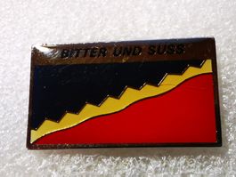 Ansteckpin 29: Bitter und süss