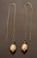 Boucle d oreille avec perle