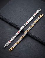 Bracelet doré et argenté, maille originale, état d'occasion