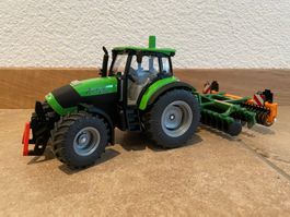 SIKU Deutz Agrotron K 110 mit Kurzscheibenegge