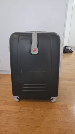 Valigia trolley rigida nera, ideale per le vacanze!