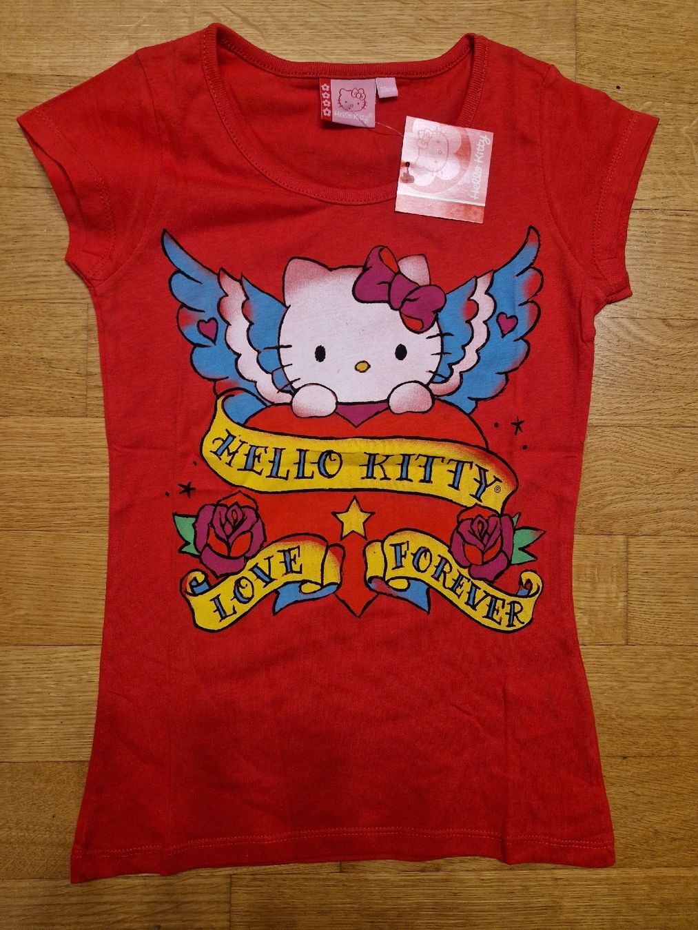 Camicette, T-shirt & Top: T-shirt Hello Kitty rouge, taille 10ans – Nuovo e nell'imballaggio originale da Penthaz venduto da Sosotroc