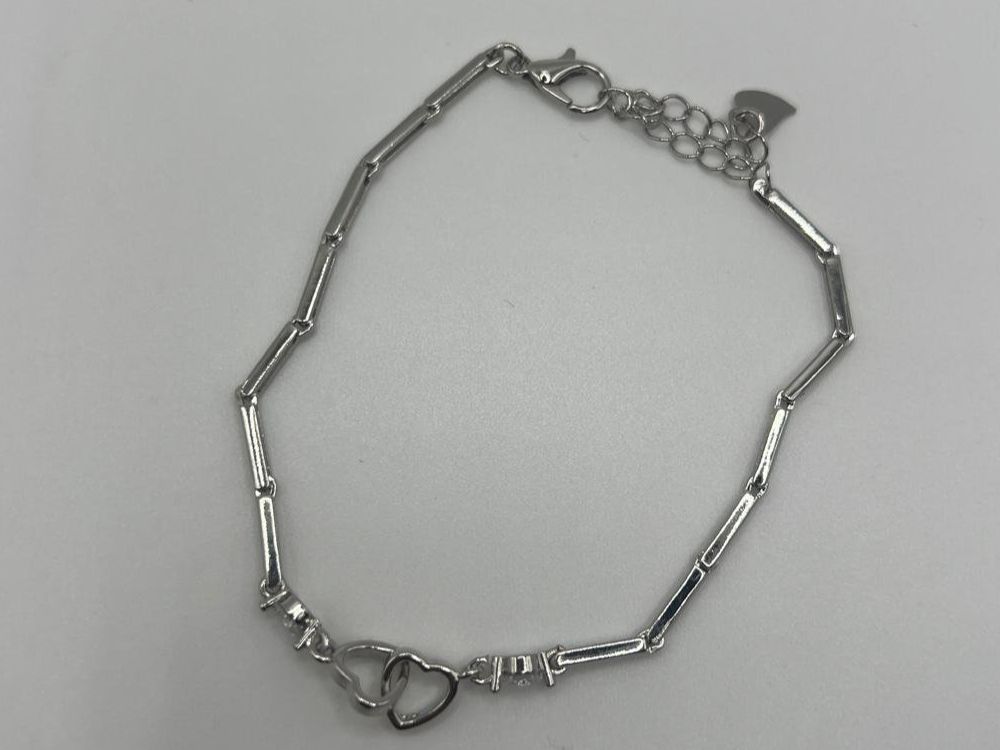 Armbänder & -reifen: Bracelet cœurs entrelacés et bâtonnets en Argent 925 – Gebraucht aus Praz (Vully) von VVSWISS 1