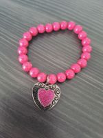 Pinkfarbenes Armband mit Herzanhänger, neuwertig!