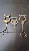3 diverse Notenhalter Metall
