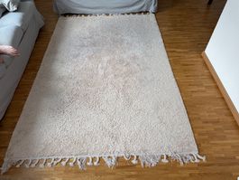 Tapis beige à franges aspect laine état correct