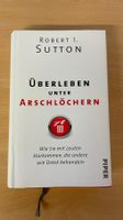 Überleben unter Arschlöchern