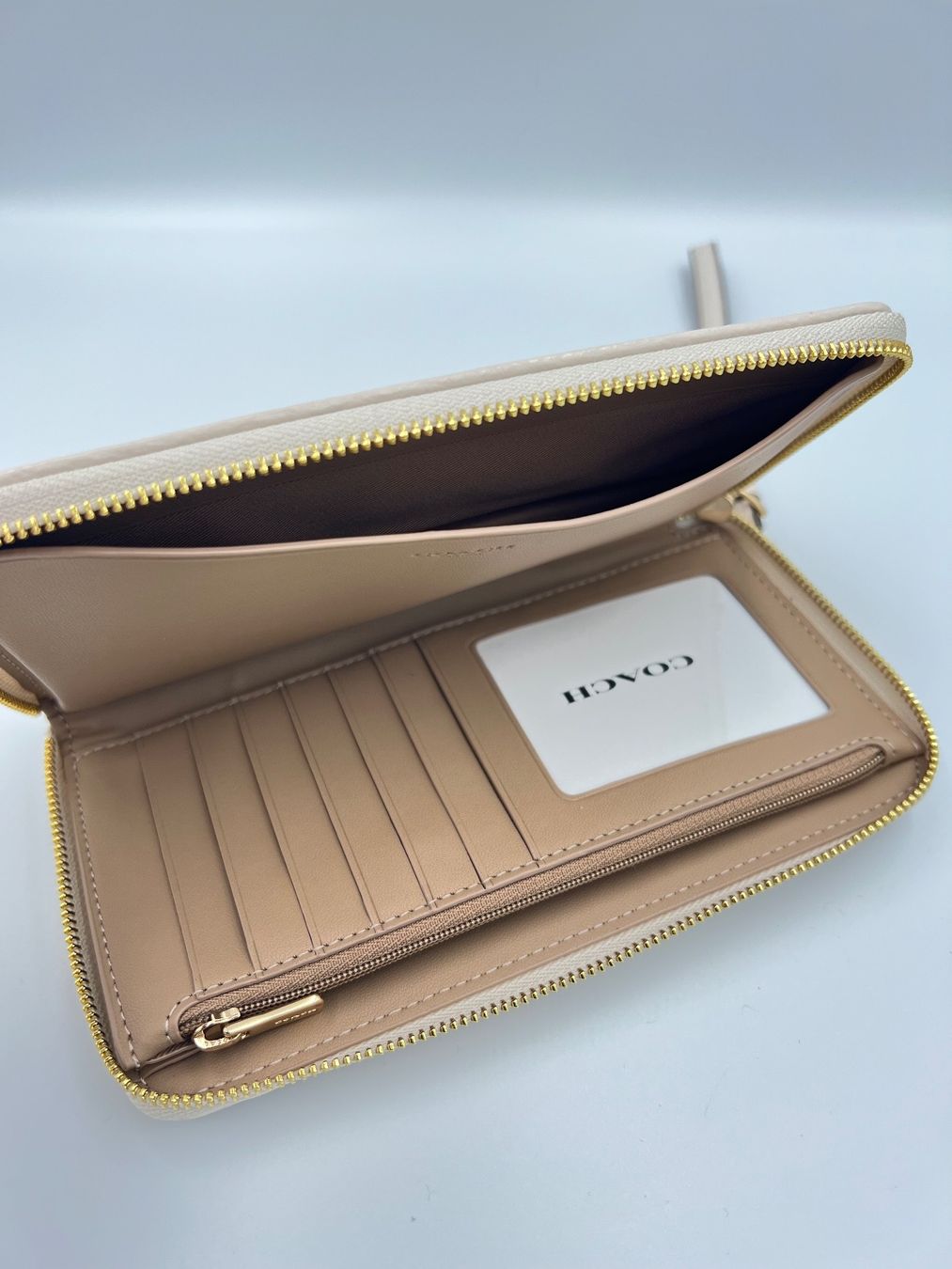 Coach Portamonete: Coach Dempsey large phone wallet weiss/beige – Nuovo e nell'imballaggio originale da Wiedlisbach venduto da Sistershop 4