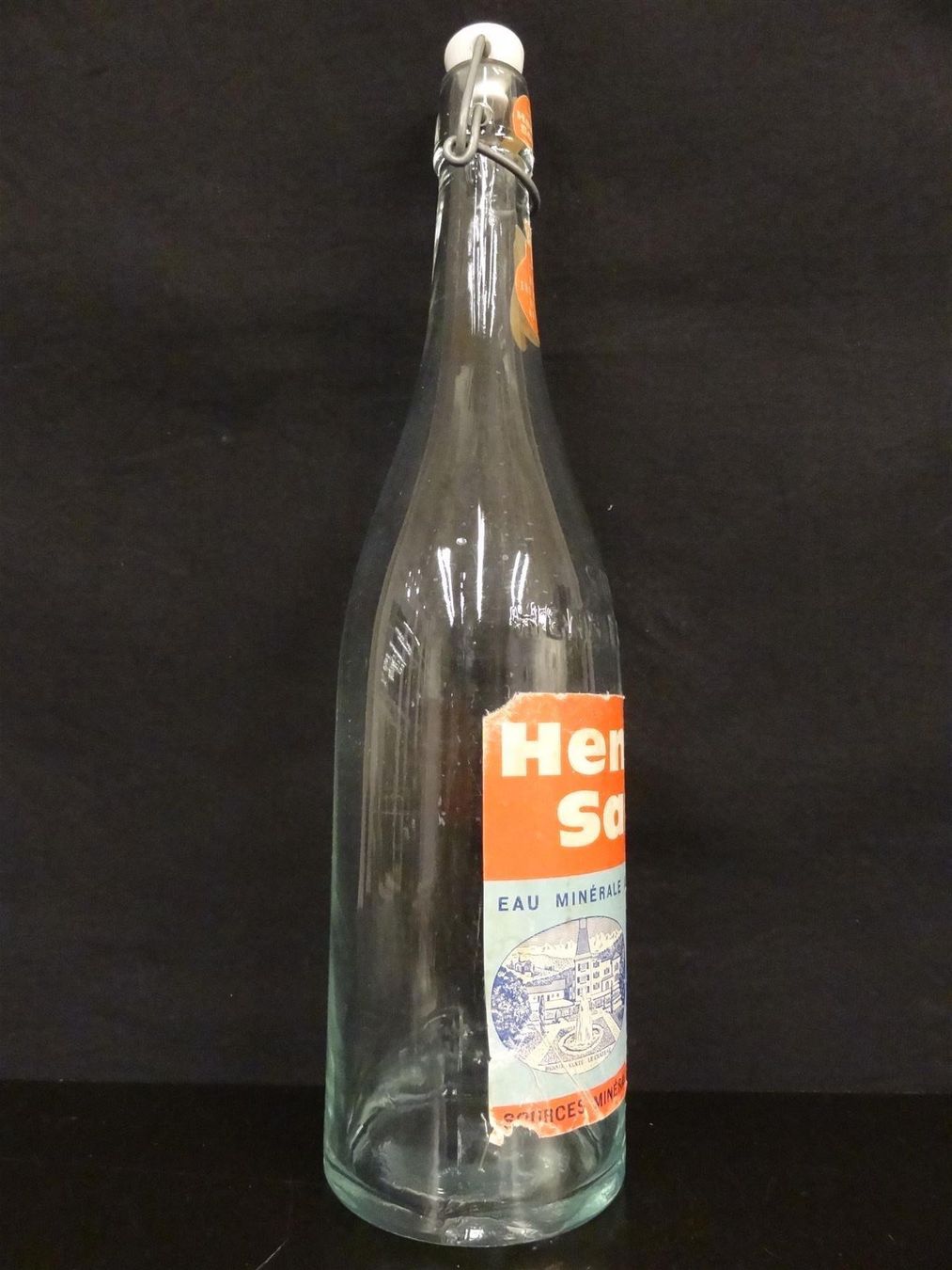 Bicchieri, Caraffe & Bottiglie: alte Flasche HENNIEZ SANTÉ – Usato da Kerzers venduto da Flaschenposten 9