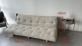 Canapé-lit "futon" beige en bon état