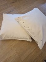 2 Kissen aus Kunstleder, creme-weiss