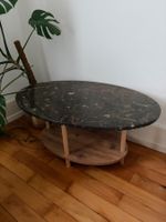 Magnifique table basse ovale marbre fossiles