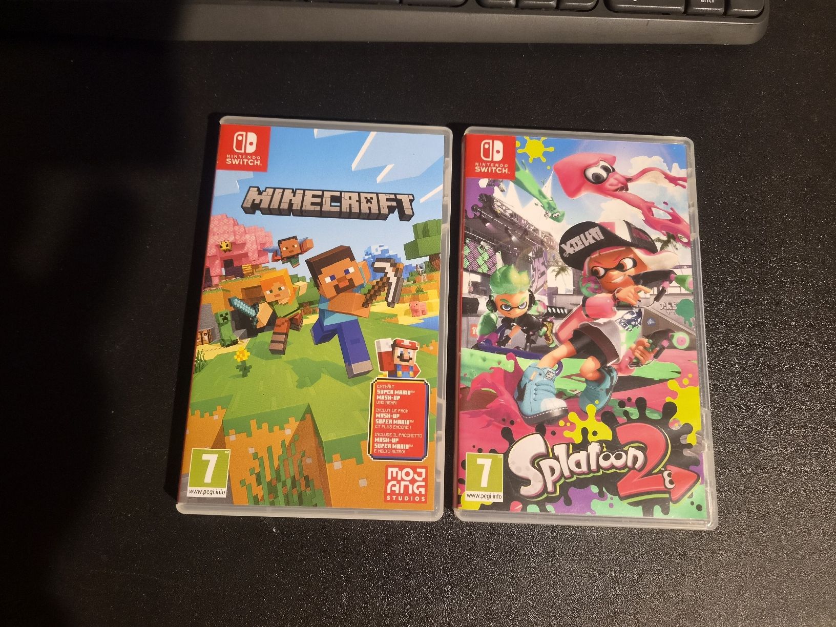 Nintendo Console: Console Nintendo Switch OLED con base e 4 joypad + 2 giochi – Usato da Bellinzona venduto da Macks 3