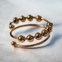 Trendiger Spiral-Ring mit Goldperlen, neuwertig!