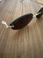 Sonnenbrille Cartier CT0504S 003, Panthère de Cartier.