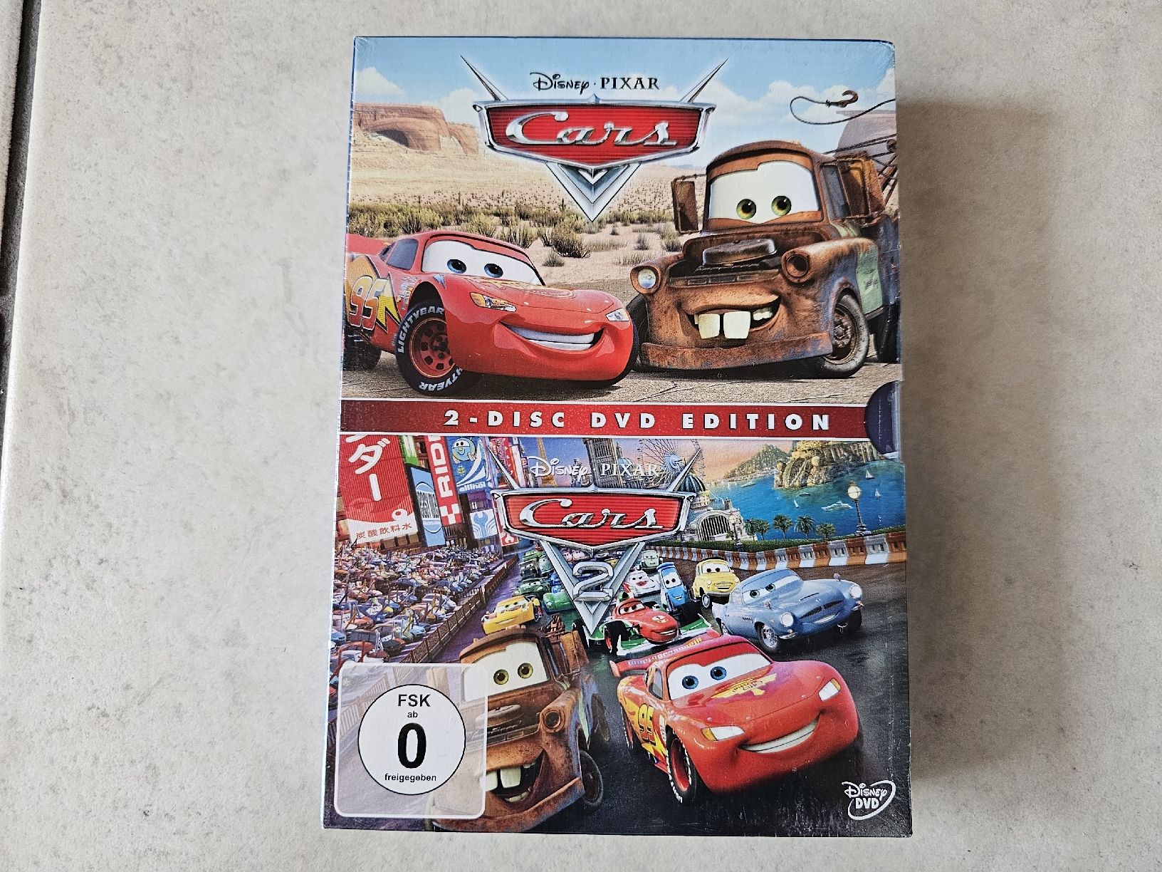 Tutti i DVDs: Cars  -  Teile 1 - 2 Box  /  Fabrikneu – Nuovo e nell'imballaggio originale da Schneisingen venduto da backstore24