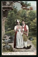 Junges Paar in Appenzeller Tracht neben 