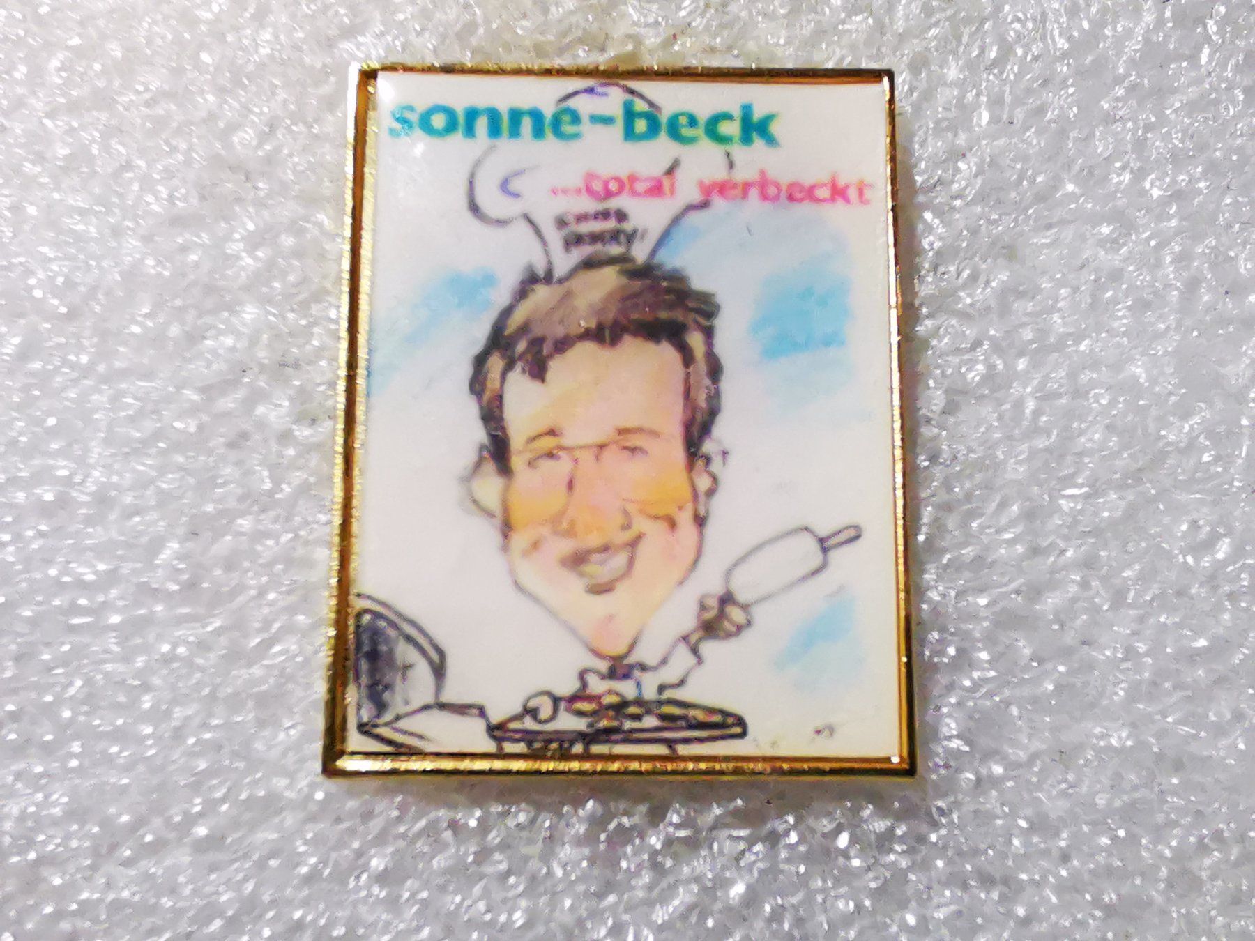 Plaketten & Abzeichen: Ansteckpin 81: Sonne Beck – Gebraucht aus Oppligen von Pin-Fall-Shop