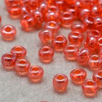 Rocailles Transparent Orangerot 15g / 2x1.5mm