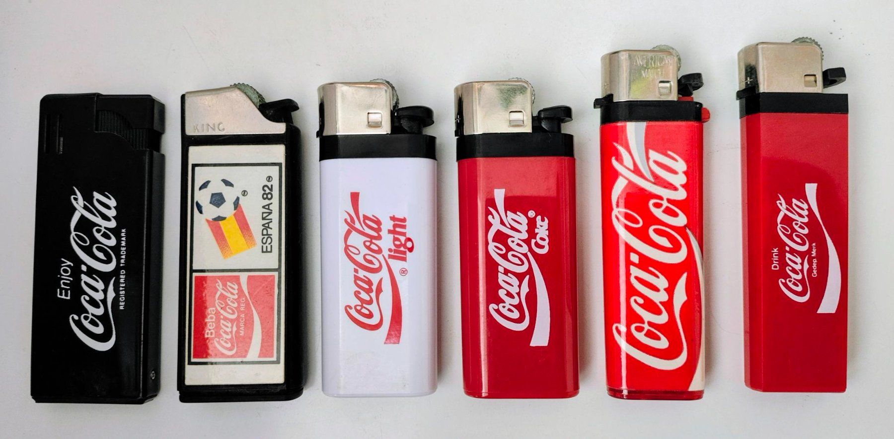 Briquets: 6 alte Coca-Cola Feuerzeuge – D'occasion à Pfäffikon ZH par Colacity