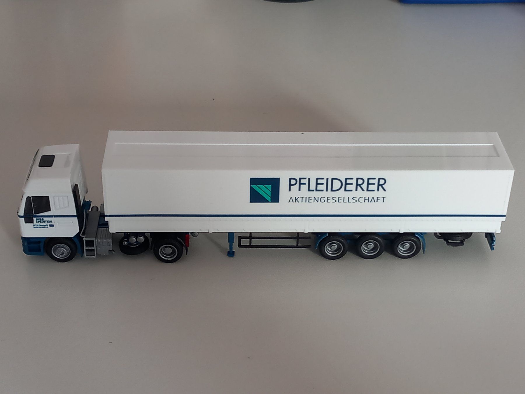 Iveco Modellini d'auto: Sattelzug IVECO AMW 1:87 Pfleiderer/ Werbemodell – Nuovo e nell'imballaggio originale da Merenschwand venduto da doc_joe 1