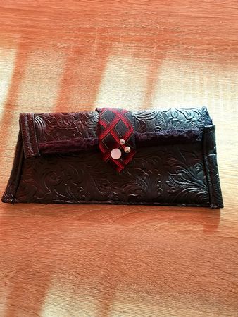 Black Clutch embossed floral pattern red detail new