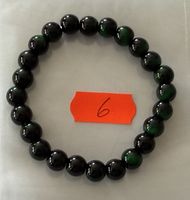 1 Stück  Armband mit grünen Edelsteinen .
