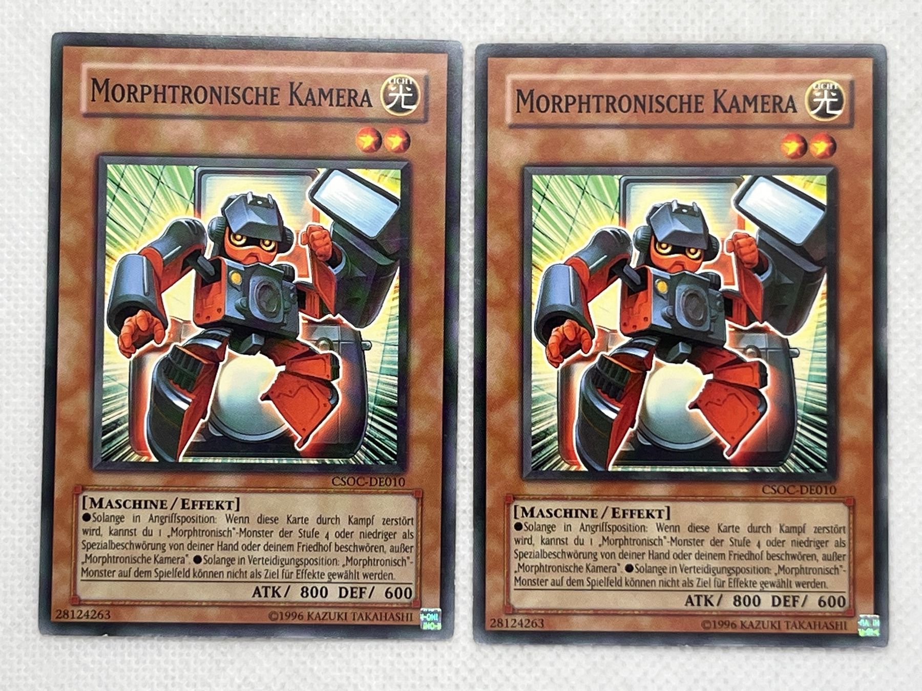Yugioh Carte collezionabili: Yu-Gi-Oh! Morphtronische Kamera CSOC-DE010 Deutsch Common 2x – Usato da Hinterkappelen venduto da Kim1992