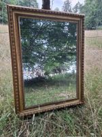 Miroir doré de style baroque