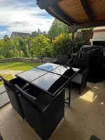 Table et 4 chaises de jardin noires